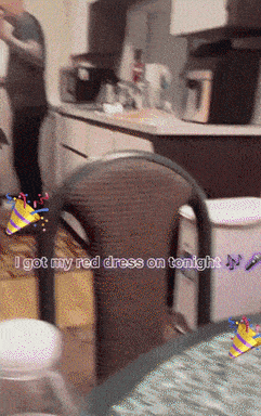a blurred image of a kitchen with the words " i got my red dress on tonight " at the bottom