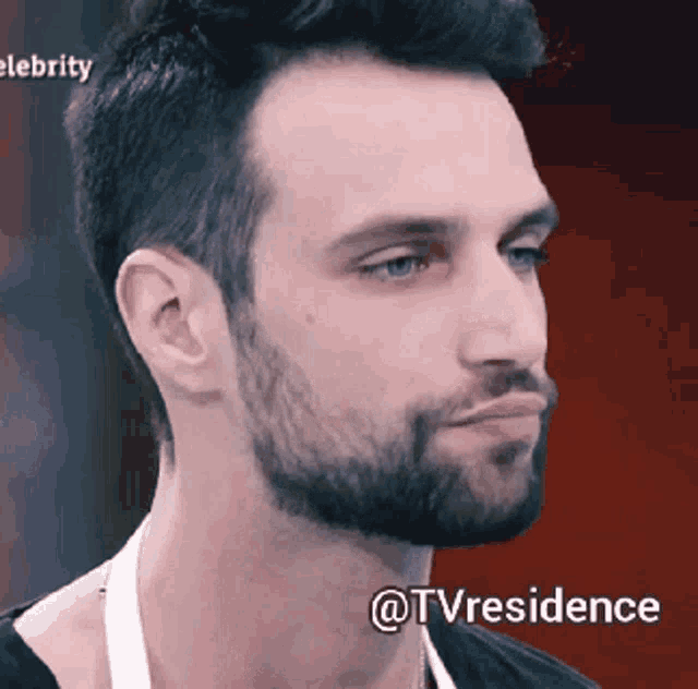 a close up of a man 's face with the words " @tvresidence " on the bottom