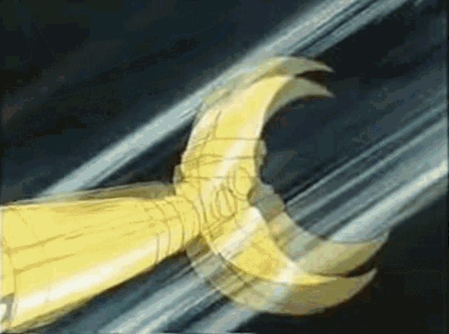 a close up of a sword with a crescent moon on it .