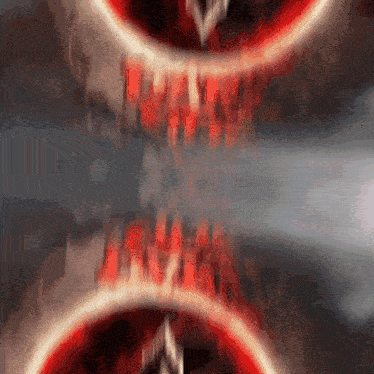 a blurry picture of a red circle with a white arrow pointing to it