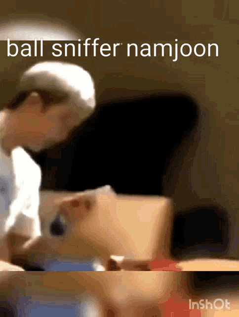 a blurred image of a person with the words ball sniffer namjoon written on it