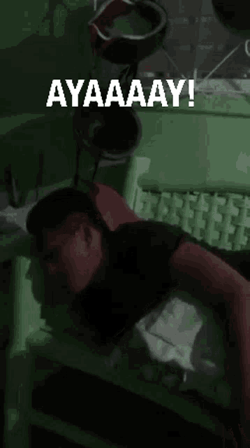 a man laying on a bed with the words ayaaay written above him