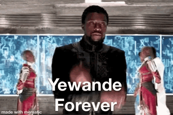 a man is standing in front of a wall with the words yewande forever written on it .