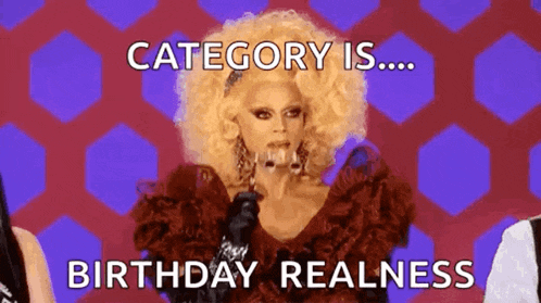 a drag queen is holding a microphone and says `` category is ... birthday realness ''