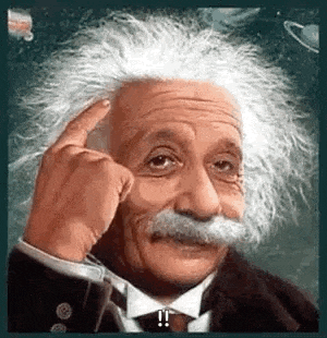 albert einstein is wearing a tuxedo and tie and pointing at his head .