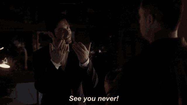 a man in a suit talks to another man and says see you never