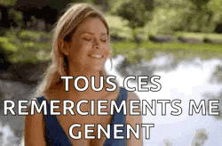 a woman in a blue dress is smiling with her eyes closed and the words `` tous ces remerciements me genent '' .