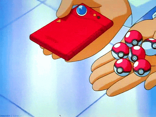 a person is holding a red box and a bunch of pokeballs in their hand