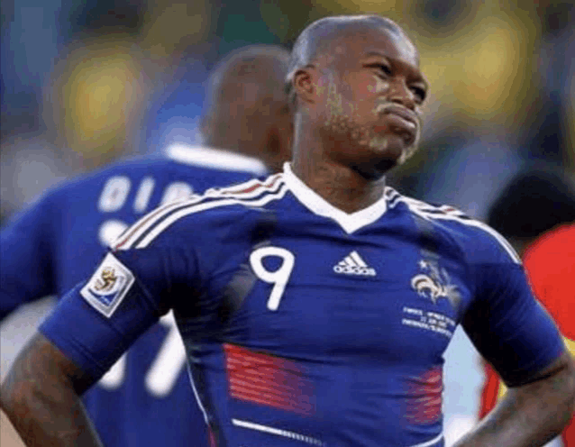 a soccer player wearing a blue adidas jersey with the number 9 on it