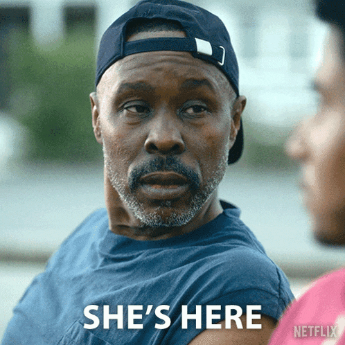 a man wearing a hat says she 's here in a netflix ad