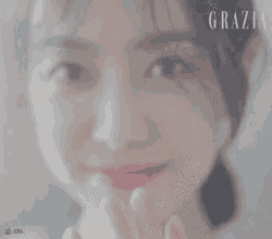 a close up of a woman 's face with the word grazia visible