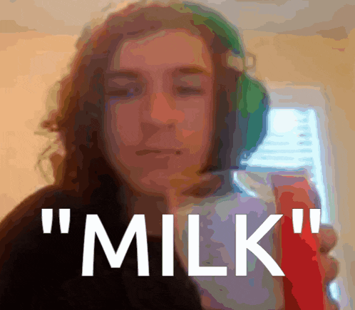 a blurry picture of a woman with the words " milk " on the bottom right