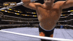 a man in a wrestling ring with the time 20:00 on the bottom right