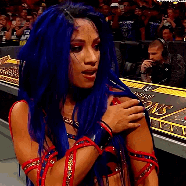 a woman with blue hair stands in front of a sign that says ' ash of champions '