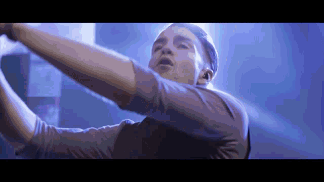 a man with his arms outstretched in the air