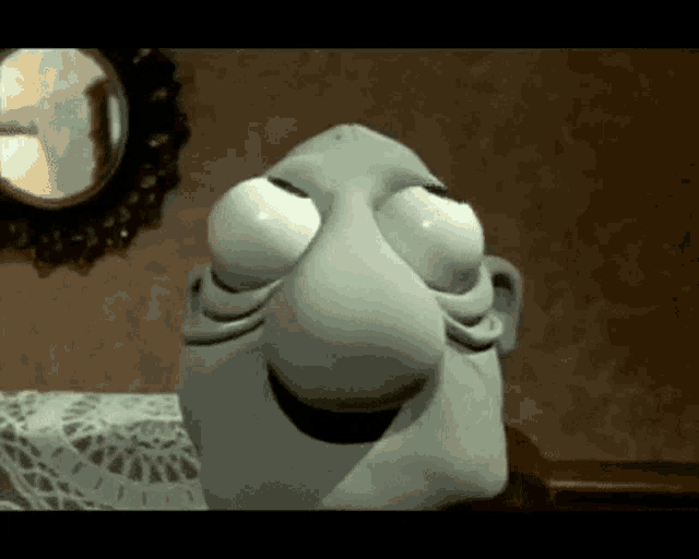 a close up of a cartoon character 's face with a big nose and big eyes .