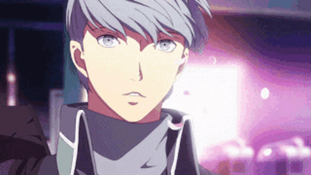 a man with gray hair and blue eyes is wearing a black jacket