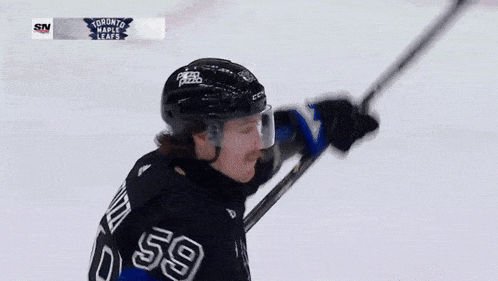 a hockey player wearing a jersey that says bertuzzi on it