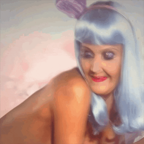 a woman wearing a blue wig with bunny ears