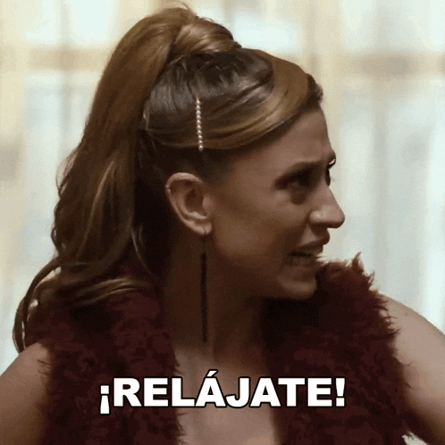 a woman in a ponytail says relajate