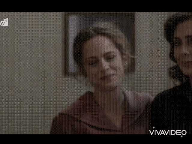 two women are standing next to each other and the word vivavideo is on the bottom right corner