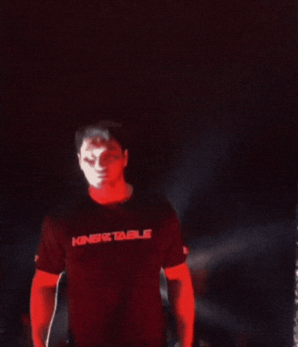a close up of a man 's face in red light