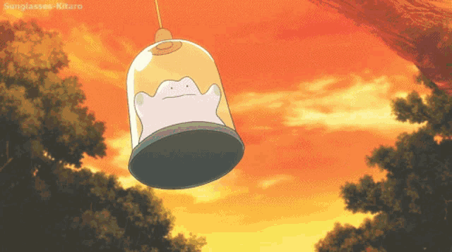 a picture of a bell with sunglasses kitaro on the bottom right