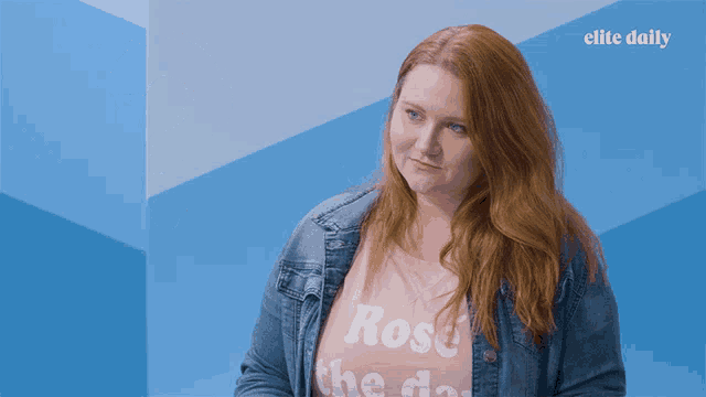 a woman wearing a pink shirt that says rose the day