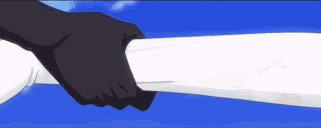 a close up of a person holding a piece of paper in their hand .