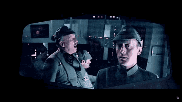 two men in military uniforms are standing next to each other and one is yawning
