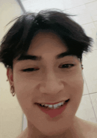 a close up of a person 's face with a smile on it