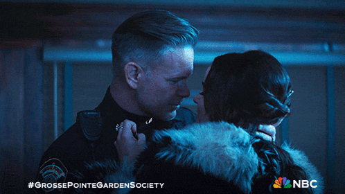 a man and woman kissing in a grosse pointe garden society advertisement
