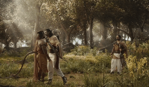 a group of men are standing in a forest talking