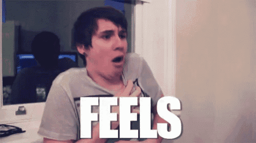 a man with a surprised look on his face is standing in front of a sign that says feels