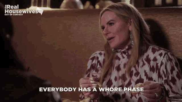 a woman eating a sandwich with the words everybody has a whore phase
