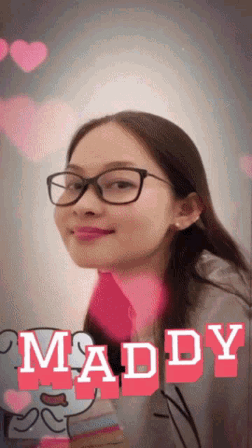 a girl with glasses and the name maddy written on it