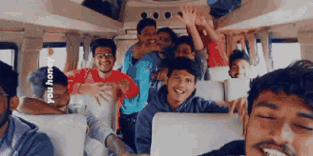 a group of young men on a bus with the words you honey on the bottom right