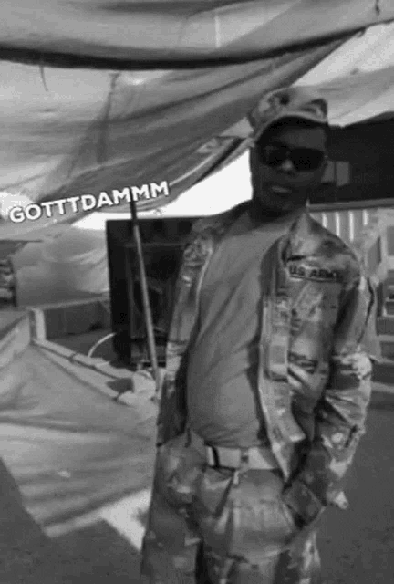a black and white photo of a man in a us army uniform