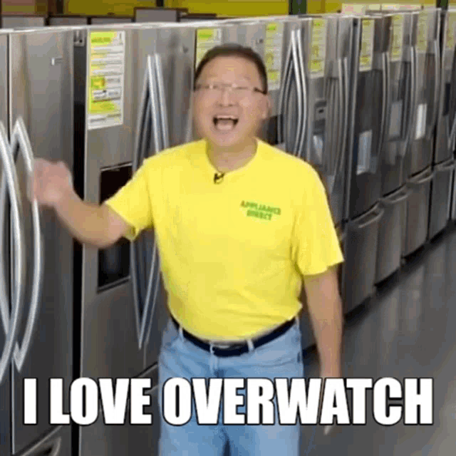 a man in a yellow shirt is standing in front of a row of refrigerators and says " i love overwatch "