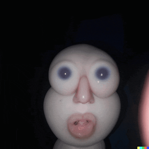 a close up of a stuffed animal 's face with big eyes