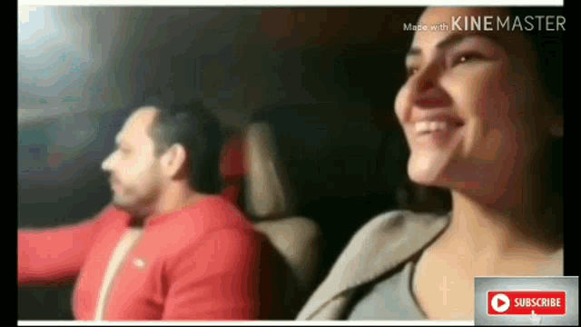 a man and a woman are sitting in a car .