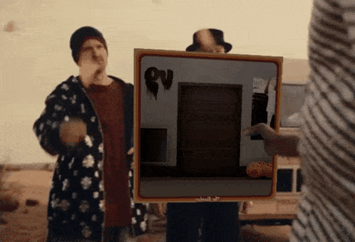 a man in a top hat is holding a picture of a door that says ' nightmare ' on it