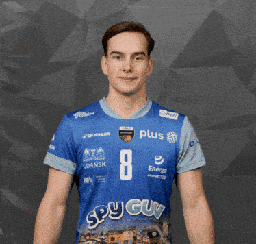 a man wearing a blue shirt that says " spu guy " on it