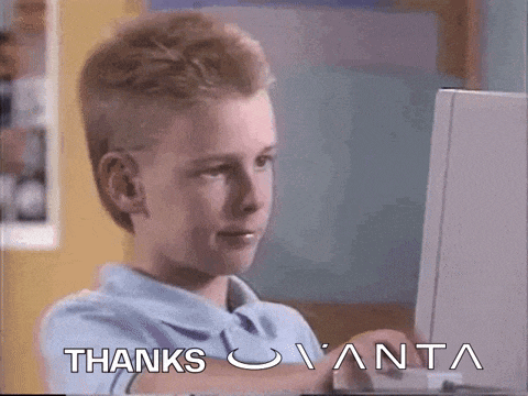 a young boy is sitting in front of a laptop with the words thanks written on the screen