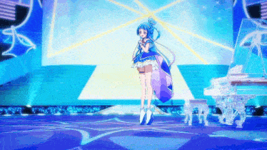 a girl with blue hair is singing on a stage
