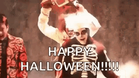 a man in a skeleton costume is standing next to a man in a costume and says `` happy halloween ! ''