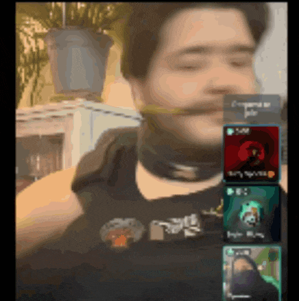 a man in a black shirt has a sticker on his neck that says ' a ' on it