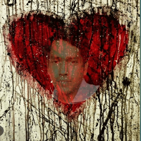 a painting of a heart with a man 's face on it