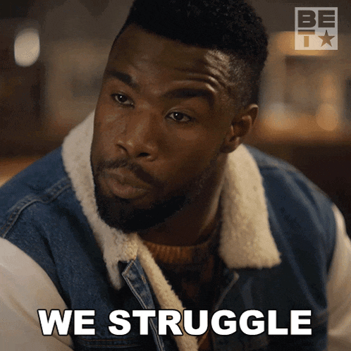 a man in a denim jacket has the words we struggle on his face