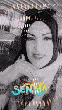 a woman wearing a hijab and sunglasses is smiling with the word semna written in the background